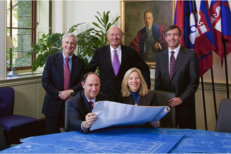 Posing with blueprint plans for the Perelman Center for Advanced Medicine in 2004: John H. Glick, MD, professor emeritus, Ralph W. Muller, former CEO of UPHS, Michael Parmacek, MD, chair of Medicine, Arthur Rubenstein, MBBCh, professor emeritus and former dean, and Amy Gutmann, University president